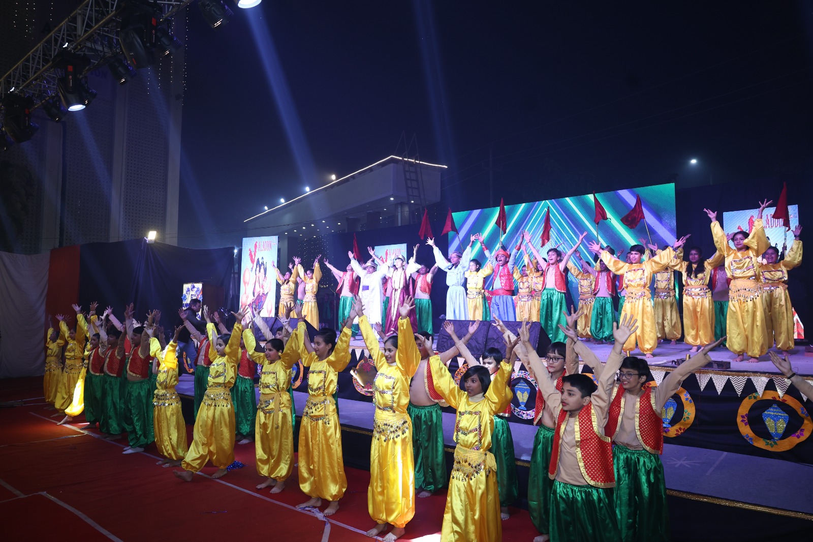 SKS World School students performing a group dance on stage